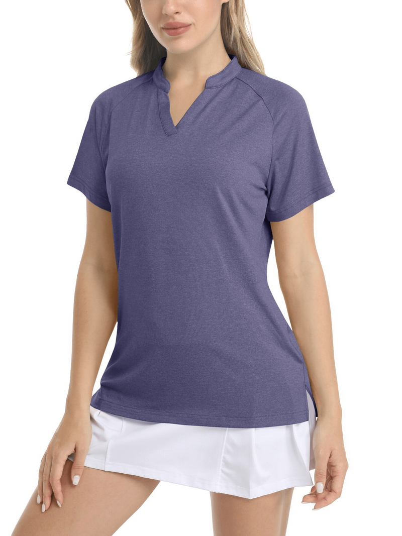 Woman wearing a purple v-neck short sleeve sports t-shirt paired with white skirt, showcasing a stylish, breathable casual look.